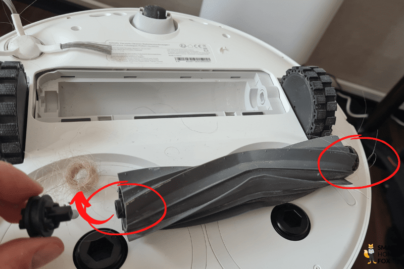 Hair is removed from the rubber brush of the Dreame L10s Ultra.